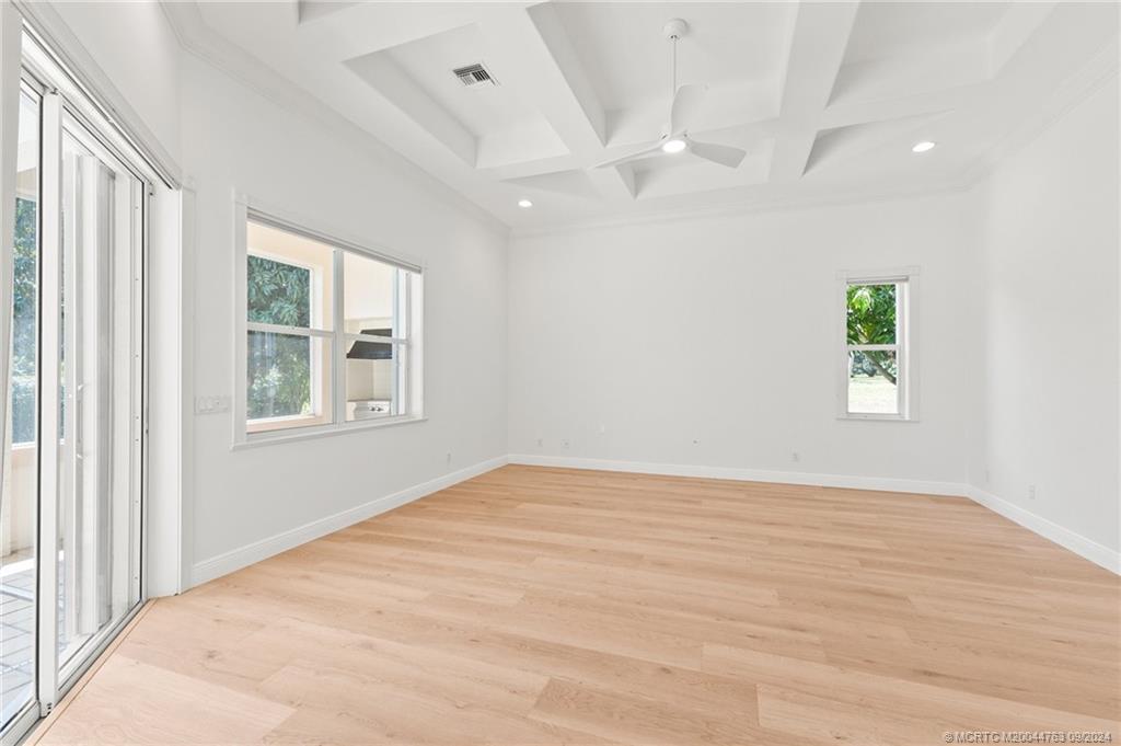 60 North River Road Stuart, FL 34996 - Photo 30 of 74 a view of an empty room with a window and wooden floor