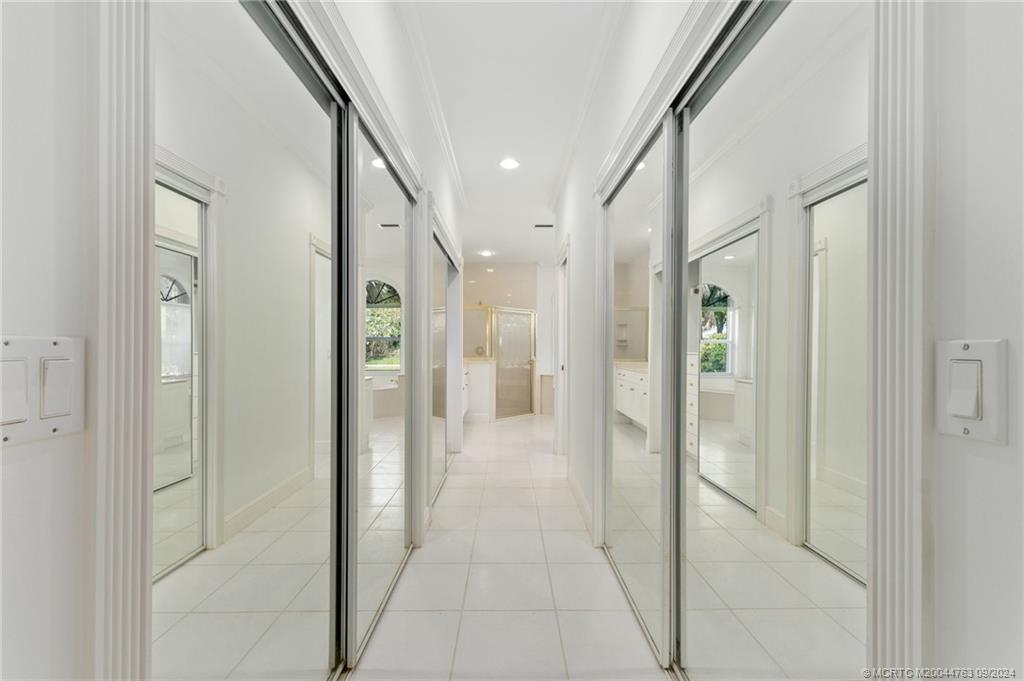 60 North River Road Stuart, FL 34996 - Photo 33 of 74 a bathroom with a shower and a glass door