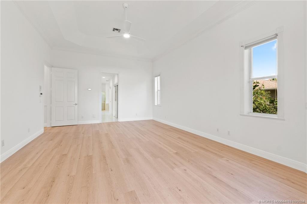 60 North River Road Stuart, FL 34996 - Photo 35 of 74 a view of an empty room with wooden floor and a window