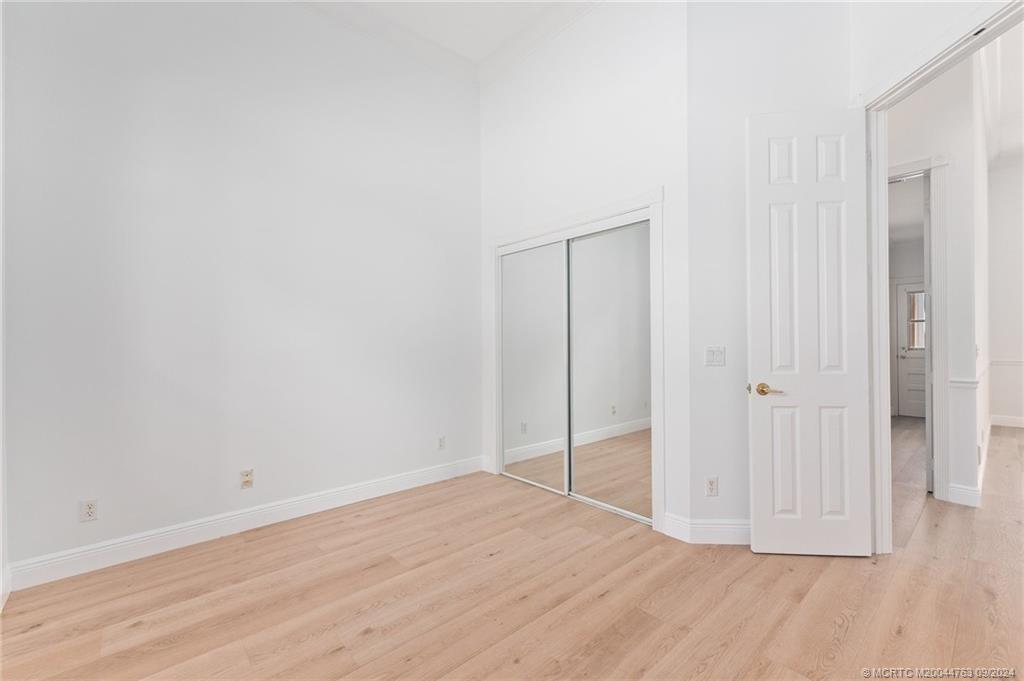60 North River Road Stuart, FL 34996 - Photo 48 of 74 a view of an empty room with wooden floor and closet