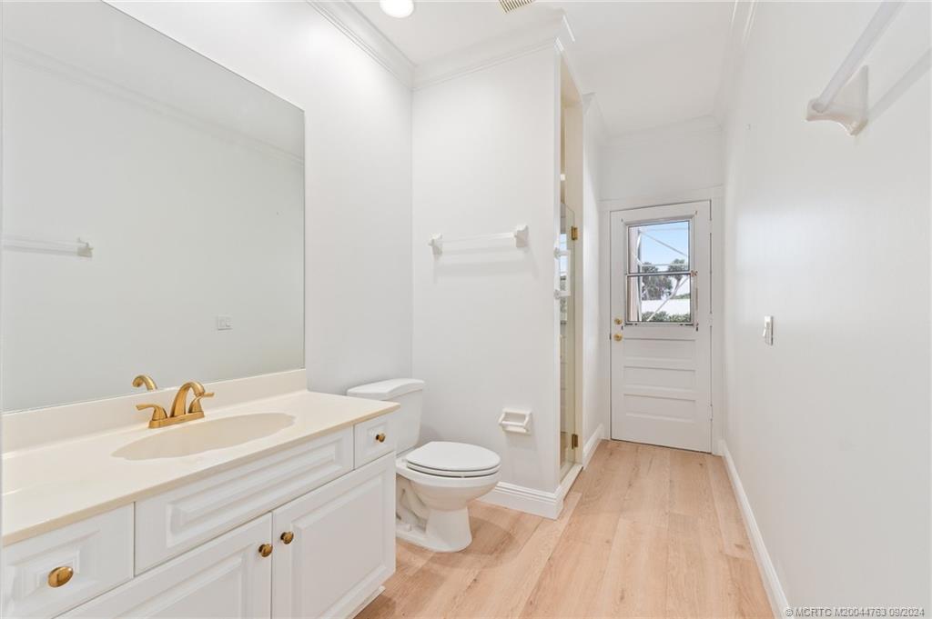 60 North River Road Stuart, FL 34996 - Photo 50 of 74 a bathroom with a sink a toilet and shower