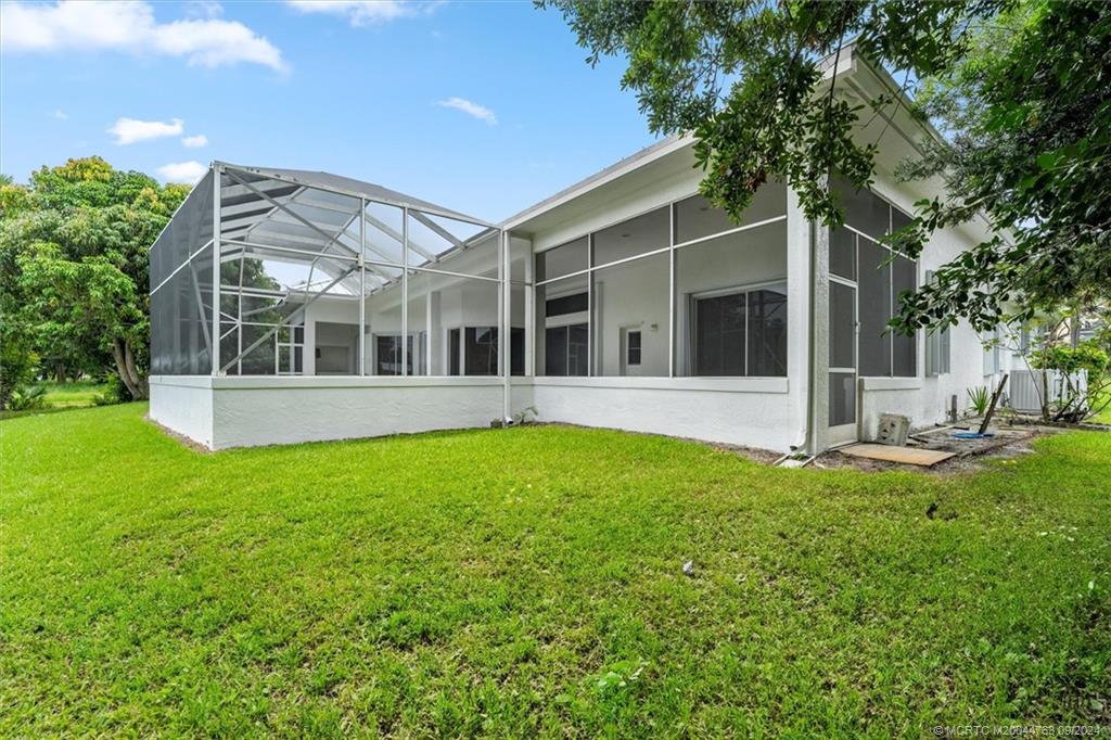 60 North River Road Stuart, FL 34996 - Photo 61 of 74 front view of a house with a yard