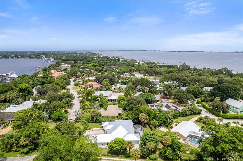 60 North River Road Stuart, FL 34996 - Photo 69 of 74 an aerial view of a city with lots of residential buildings in back