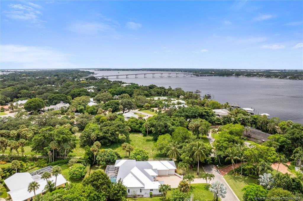 60 North River Road Stuart, FL 34996 - Photo 73 of 74 a view of a lake with houses in back