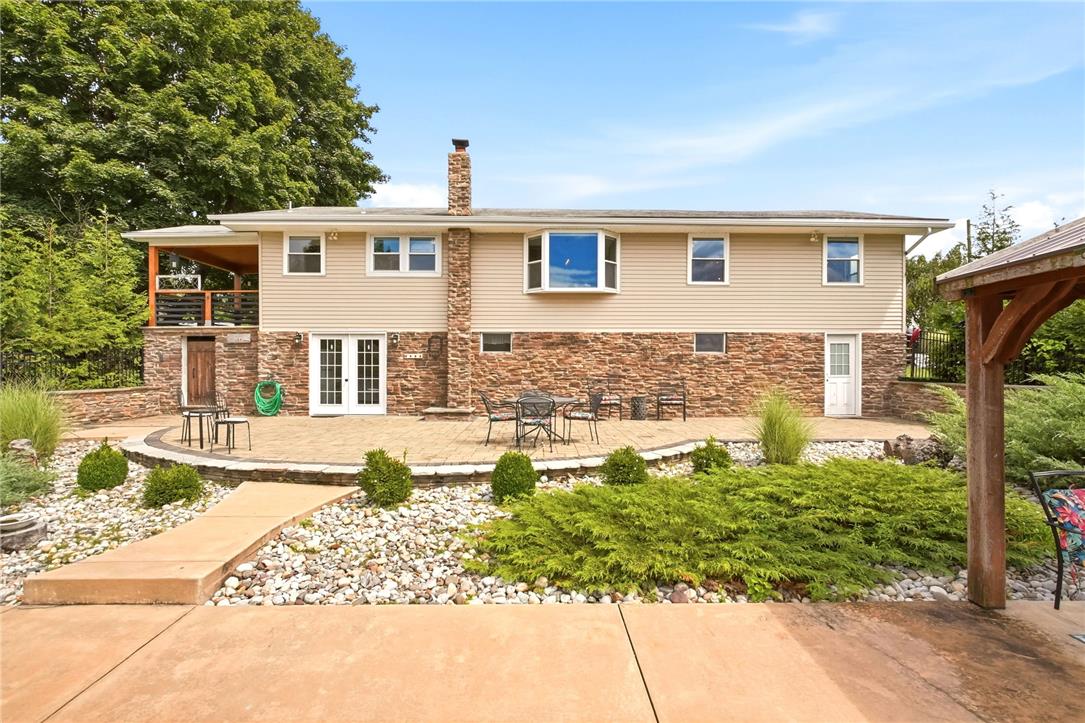 463 North Penn Dixie Road Bath, PA 18014 - Photo 64 of 86 An inviting backyard with a spacious paver patio, ideal for outdoor entertaining.
