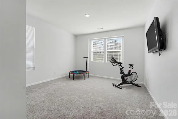 a view of a chairs and table in a patio