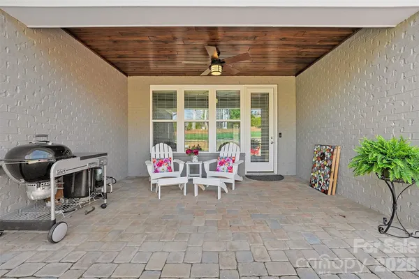 a front view of house with yard and outdoor seating