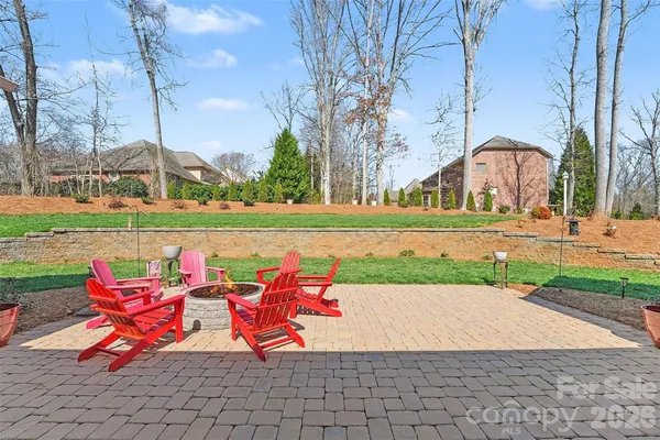 a view of a bench in back yard of the house