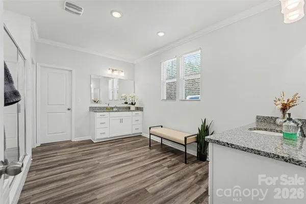 a bathroom with a glass shower door