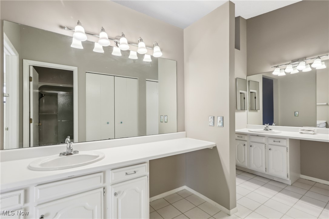 764 Hampton Ridge Drive Akron, OH 44313 - Photo 25 of 33 Primary bathroom with two sinks.