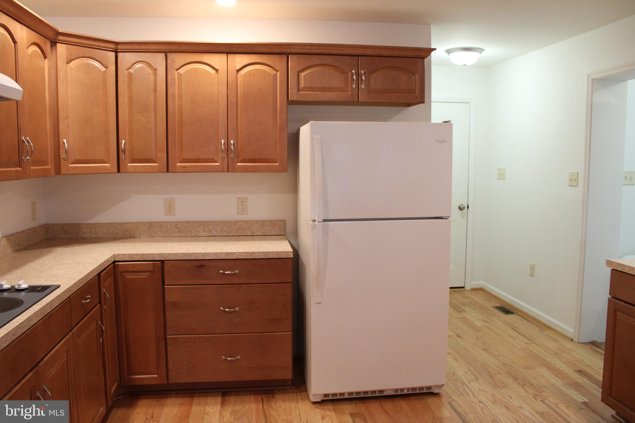 30271 Stonewall Drive Locust Grove, VA 22508 - Photo 11 of 27 a kitchen with a refrigerator and a sink