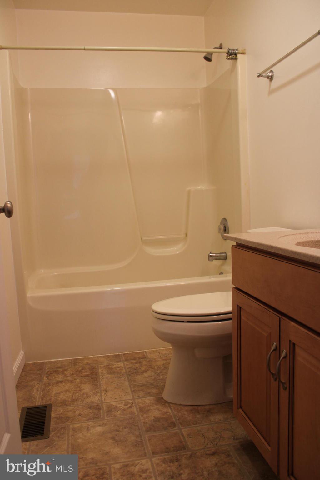 30271 Stonewall Drive Locust Grove, VA 22508 - Photo 15 of 27 a bathroom with a toilet and a shower