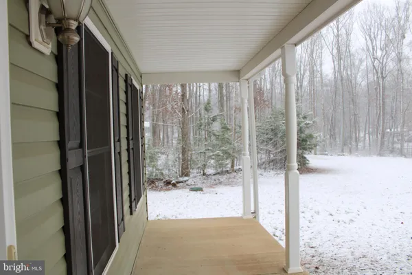 a view of a bathroom with shower and bathtub