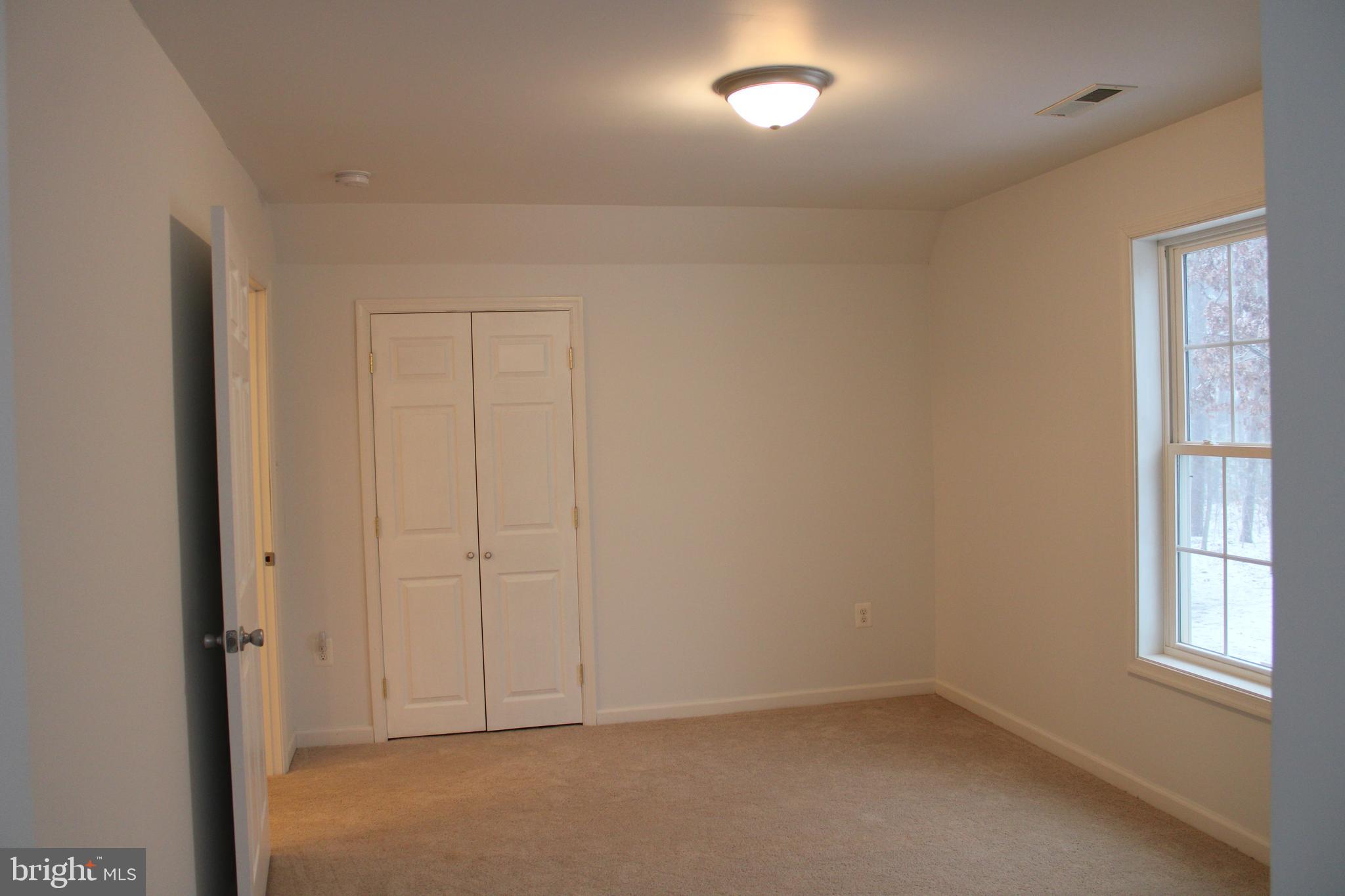 30271 Stonewall Drive Locust Grove, VA 22508 - Photo 21 of 27 an empty room with windows