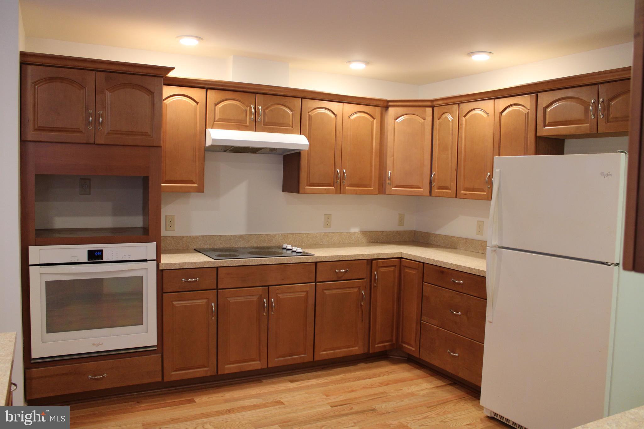 30271 Stonewall Drive Locust Grove, VA 22508 - Photo 8 of 27 a kitchen with stainless steel appliances granite countertop a refrigerator and a sink