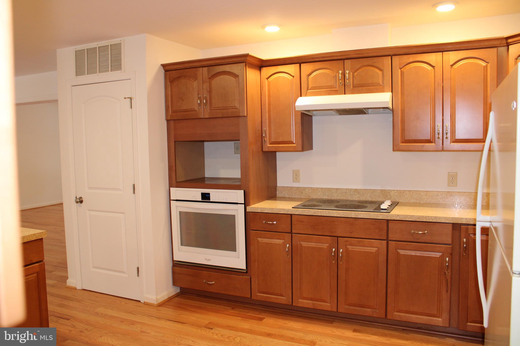 30271 Stonewall Drive Locust Grove, VA 22508 - Photo 9 of 27 a kitchen with stainless steel appliances granite countertop a refrigerator and a sink