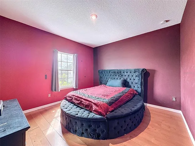 a large bathroom with a large tub and sink