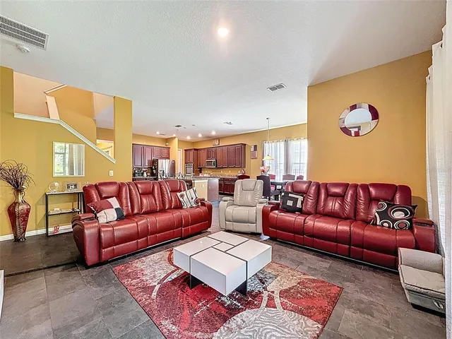 a view of a dining room with furniture window and outside view