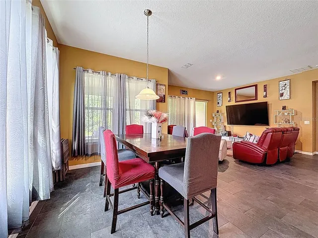 a kitchen with sink stove and cabinets