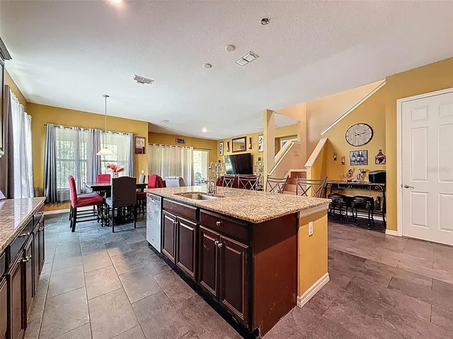a view of an entryway with wooden floor and a livingroom view