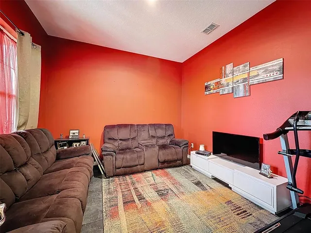 a view of a hallway with wooden shelves