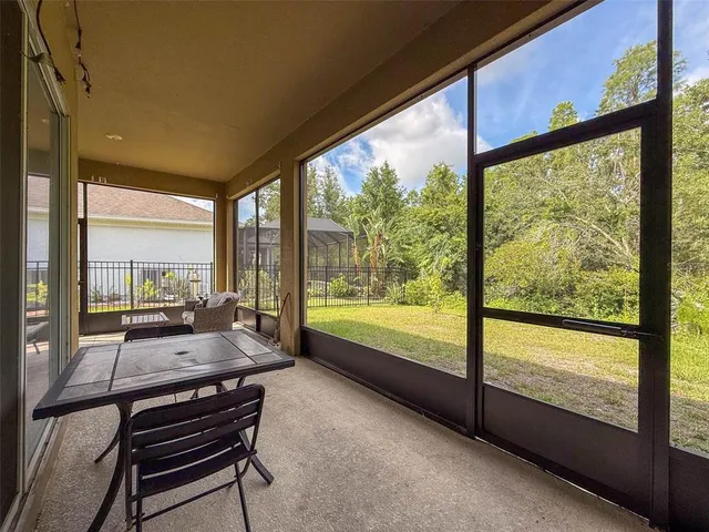a view of a house with backyard and porch