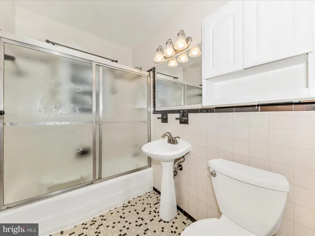 a view of a livingroom with furniture and staircase