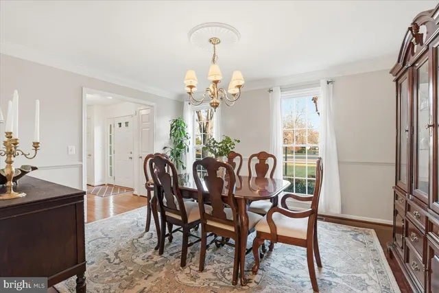 a living room with furniture rug and window