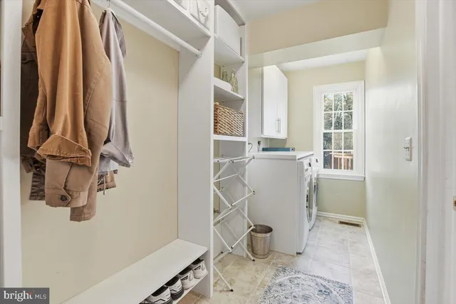 a bathroom with a toilet a sink and a mirror