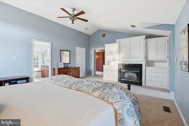 a spacious bathroom with a granite countertop tub sink and mirror
