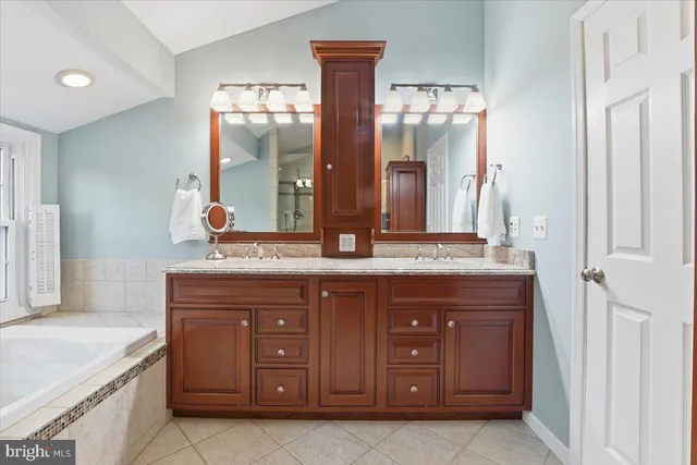 a spacious bedroom with a bed and a window