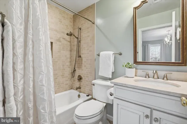 a bedroom with a bed lamp and a window