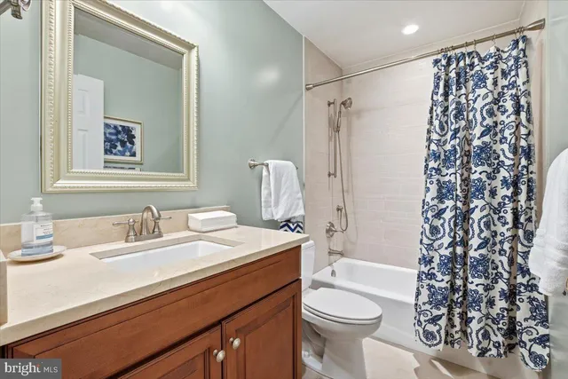 a room with furniture a flat screen tv and a chandelier