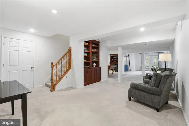 a room with furniture pool table and fire place