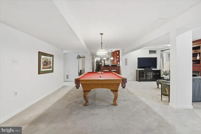 a view of a livingroom with furniture and a flat screen tv