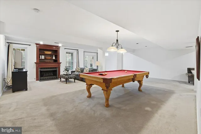 a living room with furniture flat screen tv and a fireplace