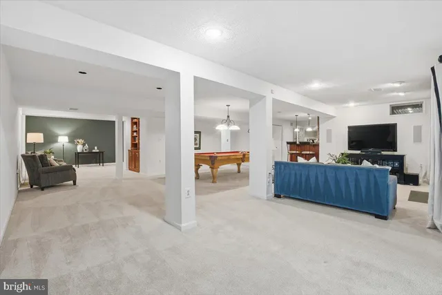a kitchen with stainless steel appliances granite countertop wooden cabinets a sink and a counter top space