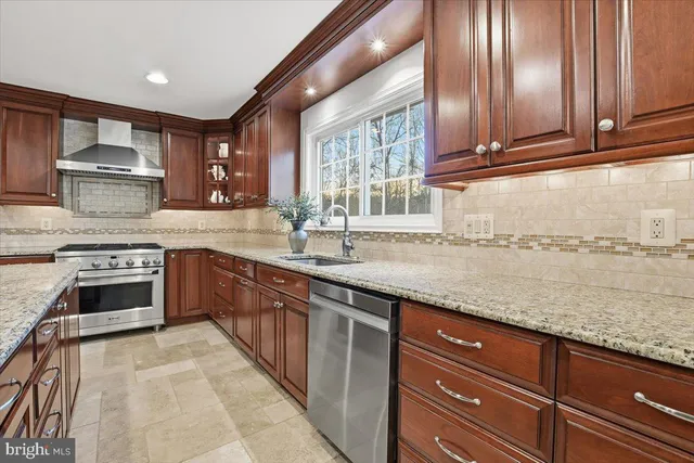 a living room with furniture a chandelier and a dining table
