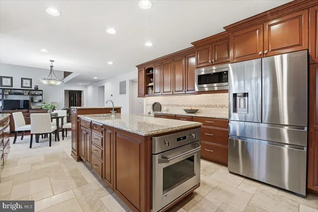 a living room with fireplace furniture and a fireplace