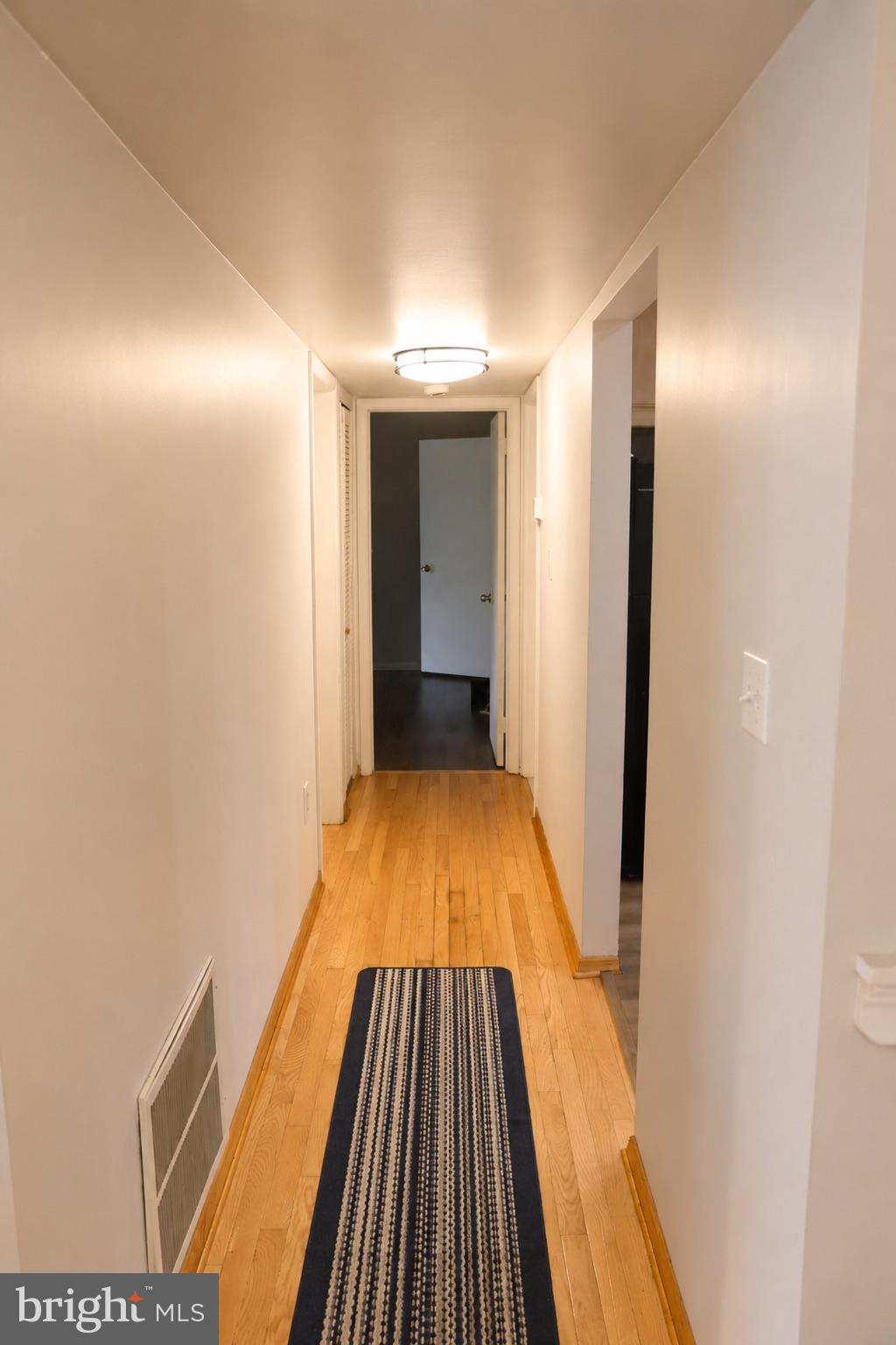 25 South Church Road, Unit 52 Maple Shade, NJ 08052 - Photo 5 of 10 a view of a hallway with wooden floor