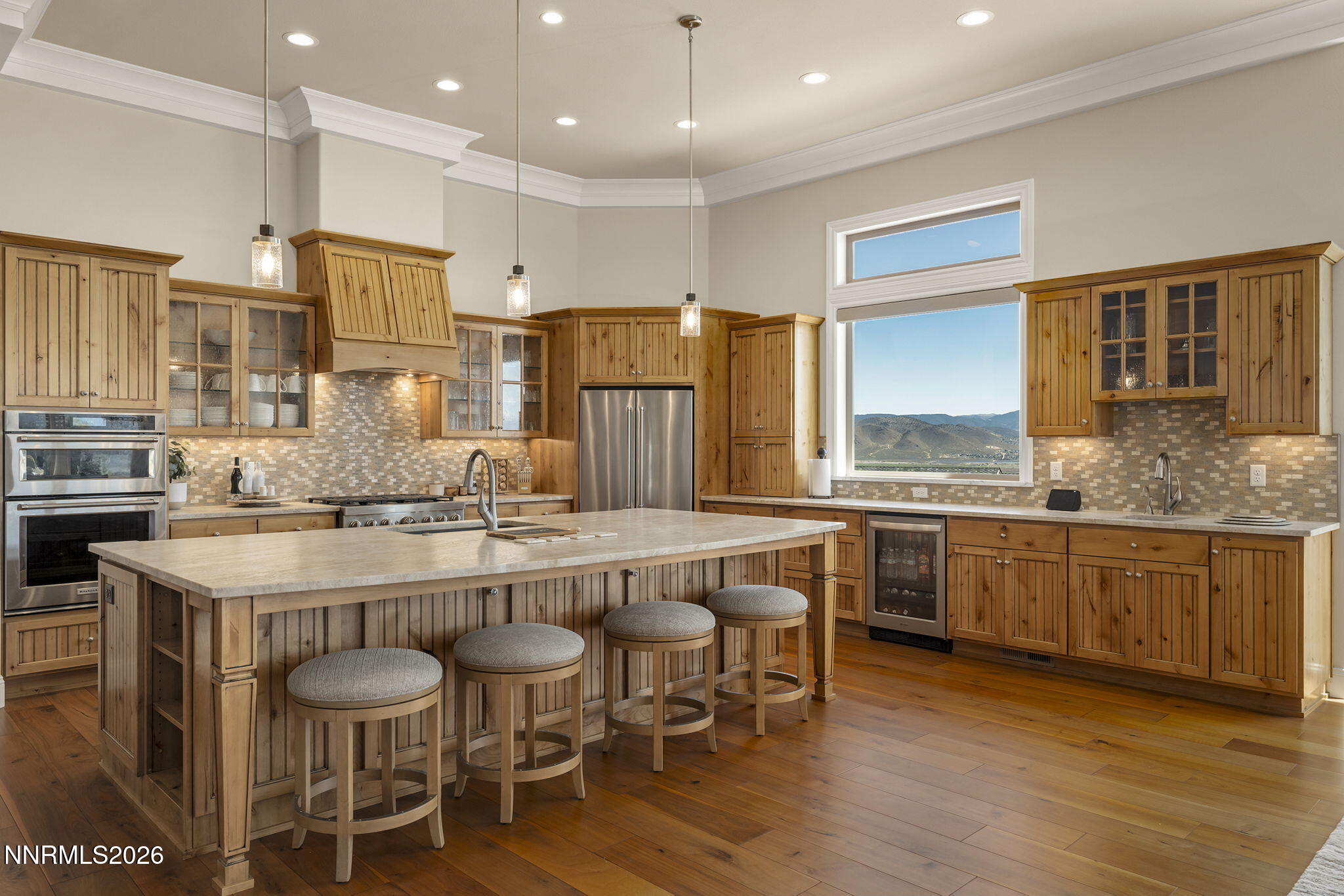 342 James Canyon Loop Genoa, NV 89411 - Photo 13 of 51 a large kitchen with a table and chairs in it