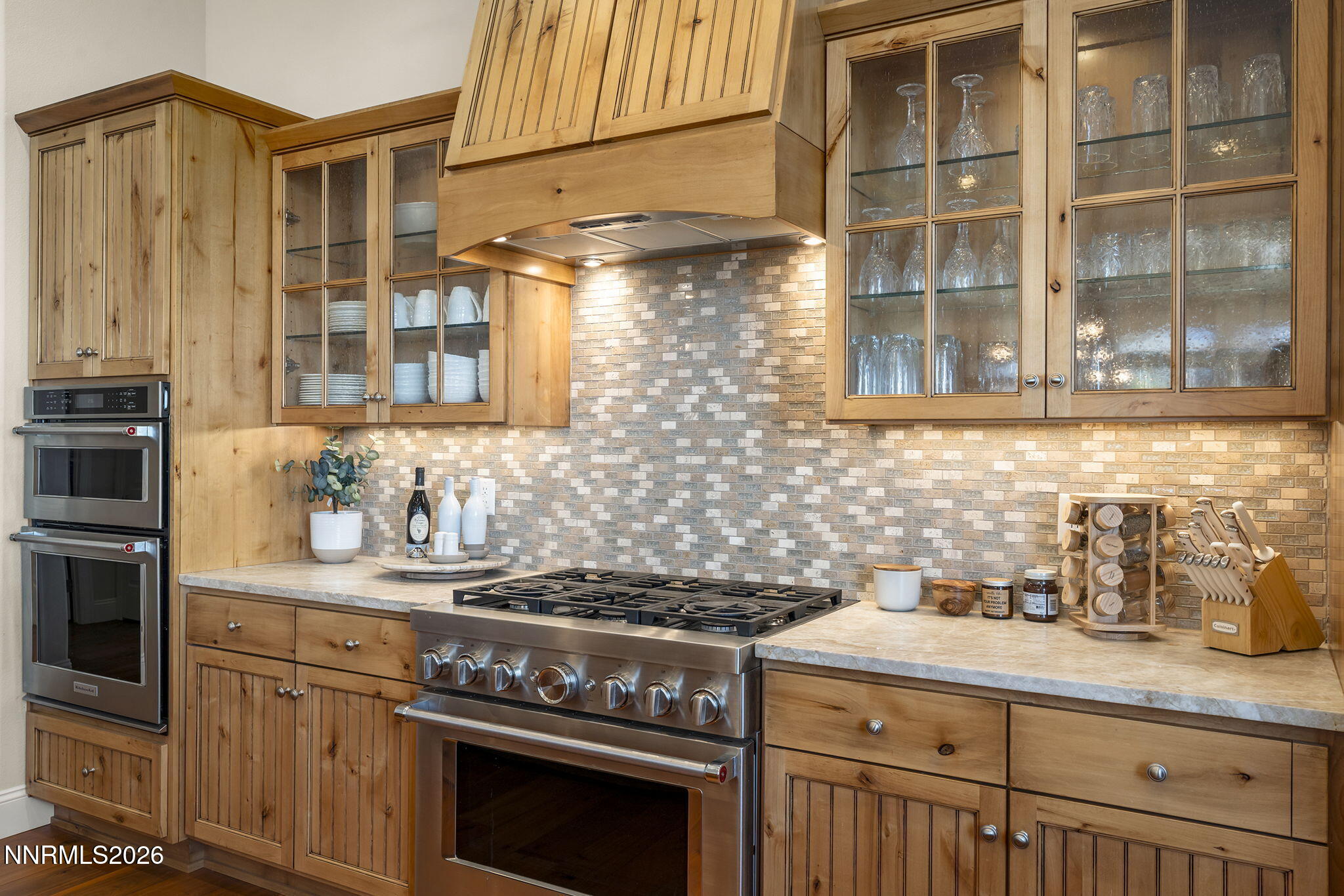 342 James Canyon Loop Genoa, NV 89411 - Photo 15 of 51 a kitchen with stainless steel appliances granite countertop a stove and a sink