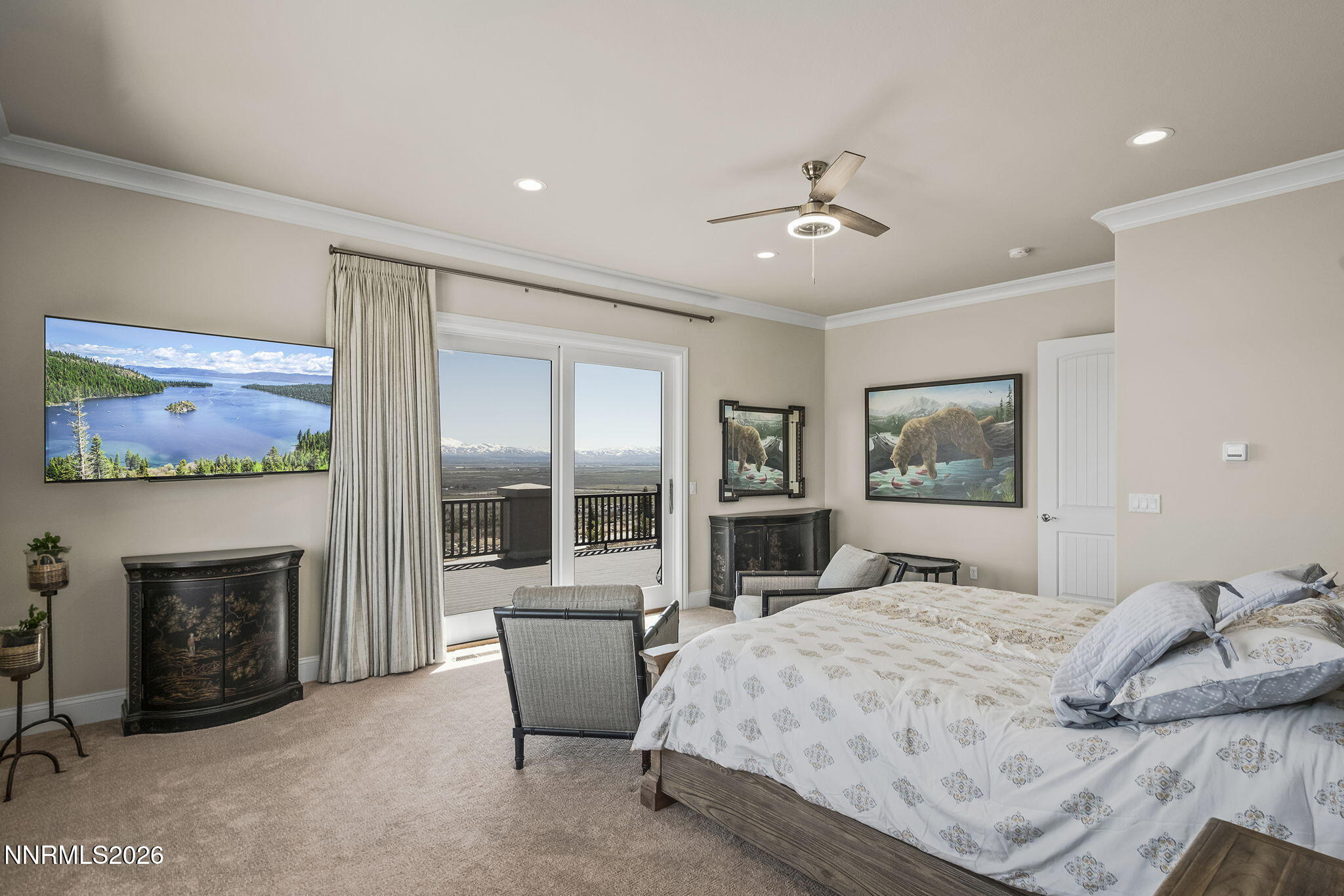 342 James Canyon Loop Genoa, NV 89411 - Photo 18 of 51 a bedroom with a large bed and a fireplace
