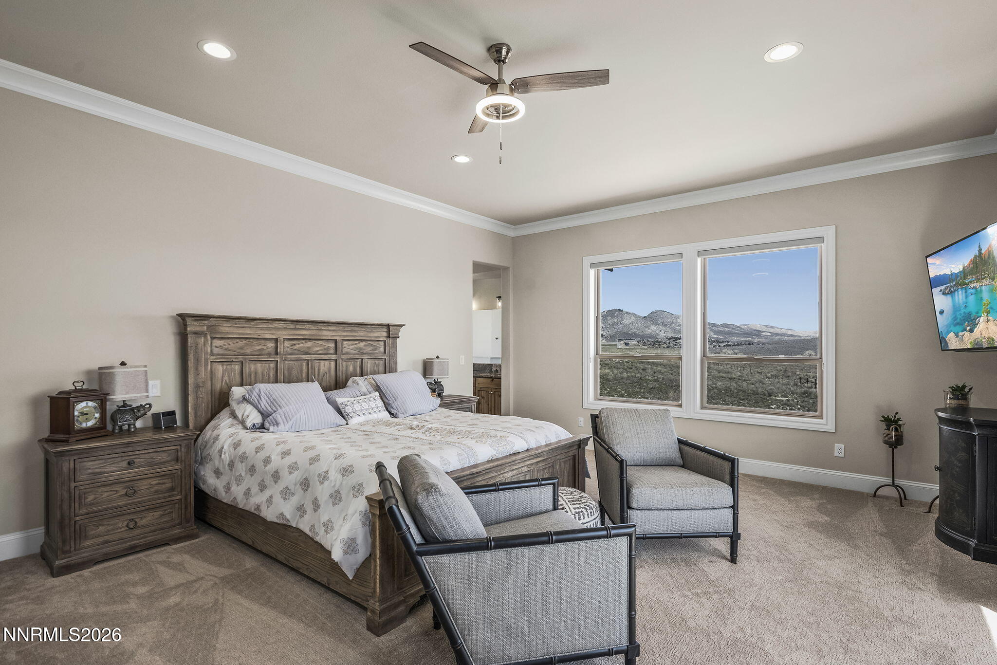 342 James Canyon Loop Genoa, NV 89411 - Photo 19 of 51 a bedroom with a bed a couch and a window