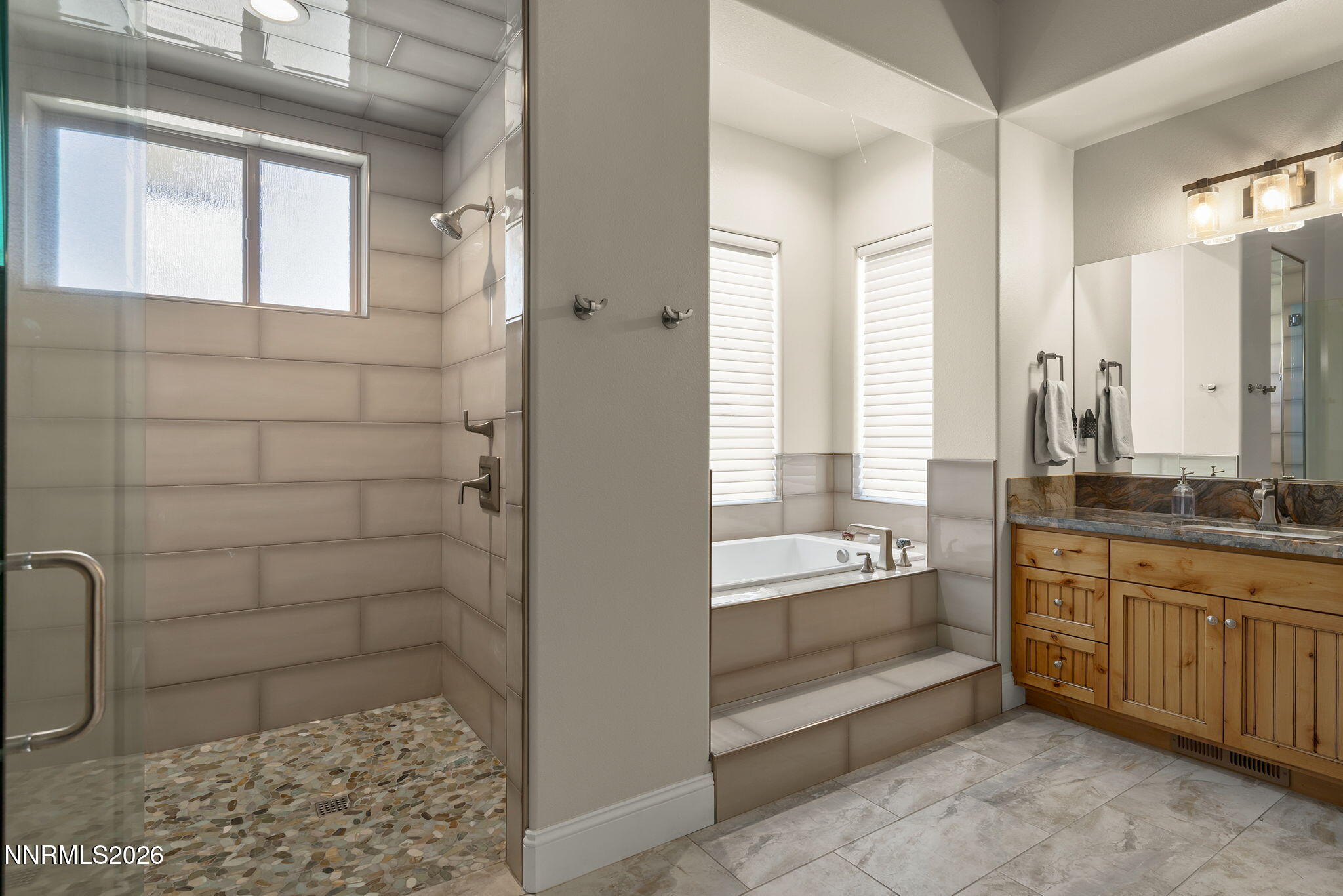 342 James Canyon Loop Genoa, NV 89411 - Photo 20 of 51 a bathroom with a bathtub and a sink