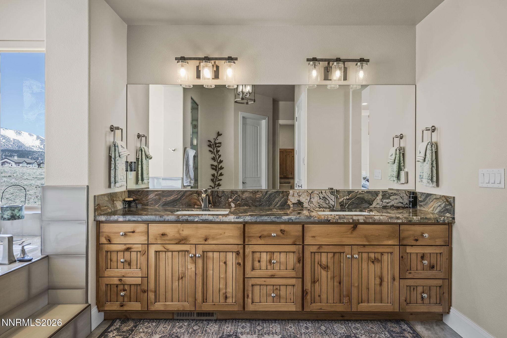 342 James Canyon Loop Genoa, NV 89411 - Photo 21 of 51 a bathroom with a granite countertop double vanity sink and a mirror