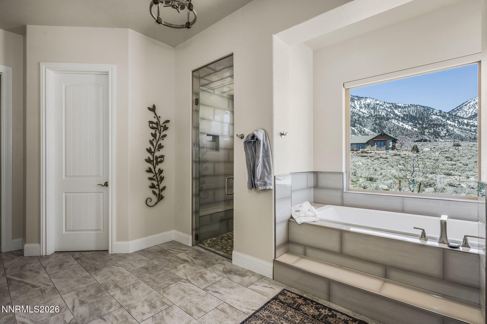 342 James Canyon Loop Genoa, NV 89411 - Photo 23 of 51 a bathroom with a bathtub and shower