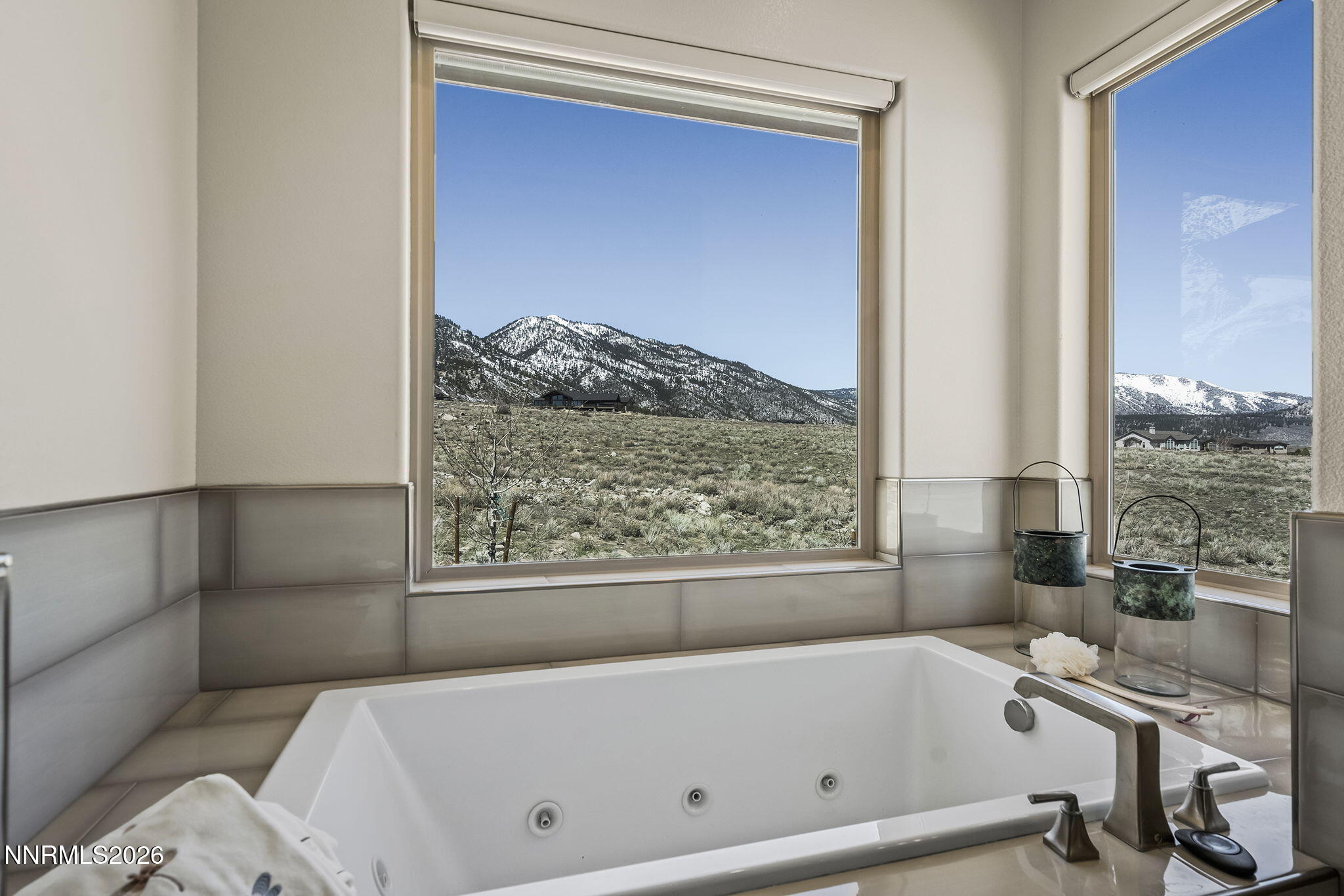 342 James Canyon Loop Genoa, NV 89411 - Photo 24 of 51 a bathroom with a bathtub and a window