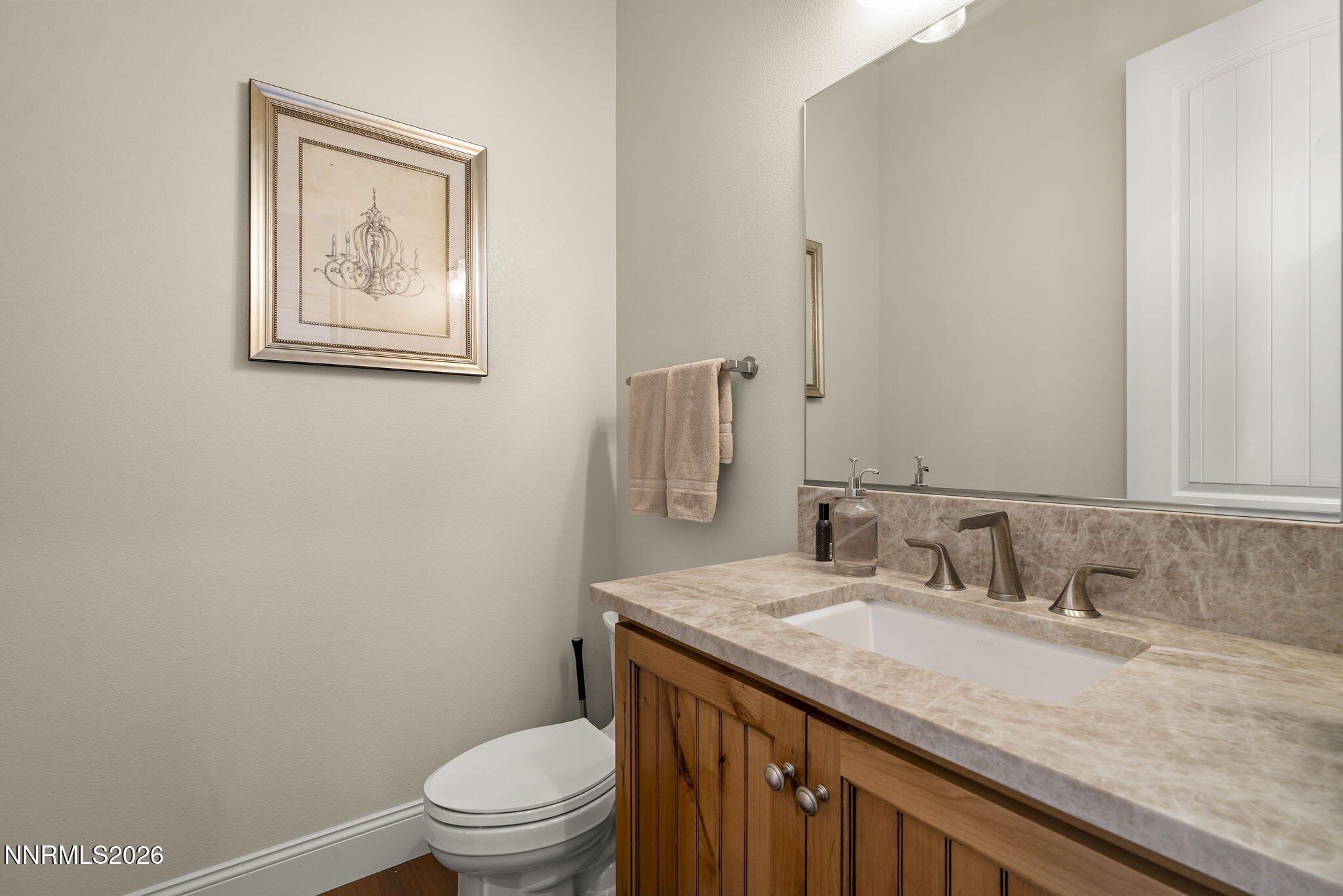 342 James Canyon Loop Genoa, NV 89411 - Photo 30 of 51 a bathroom with a granite countertop sink a toilet and a mirror