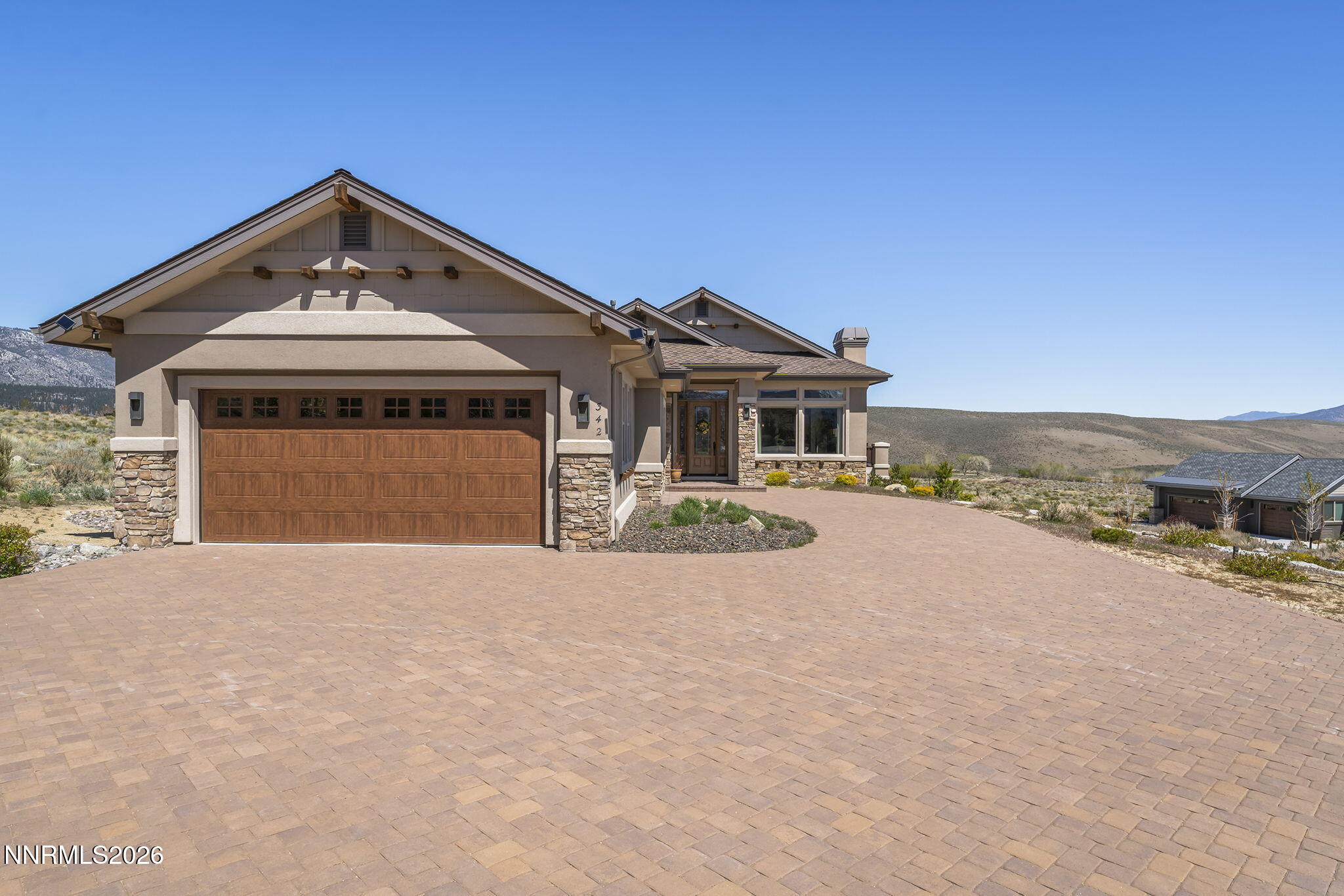 342 James Canyon Loop Genoa, NV 89411 - Photo 4 of 51 a front view of a house with a yard